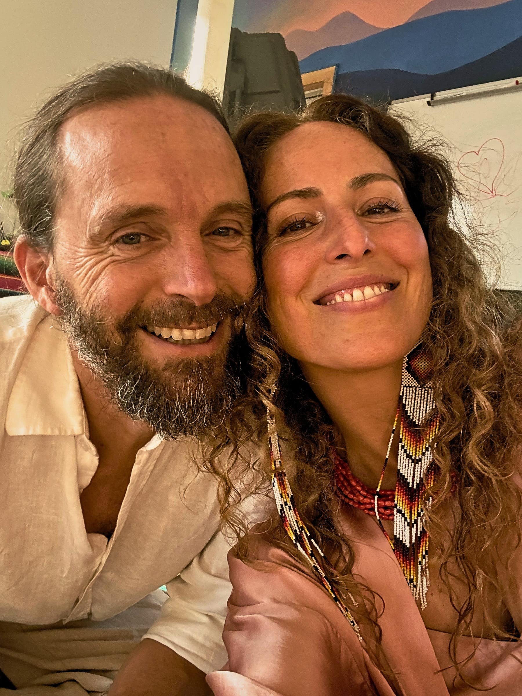 Smiling couple leaning close together in a selfie